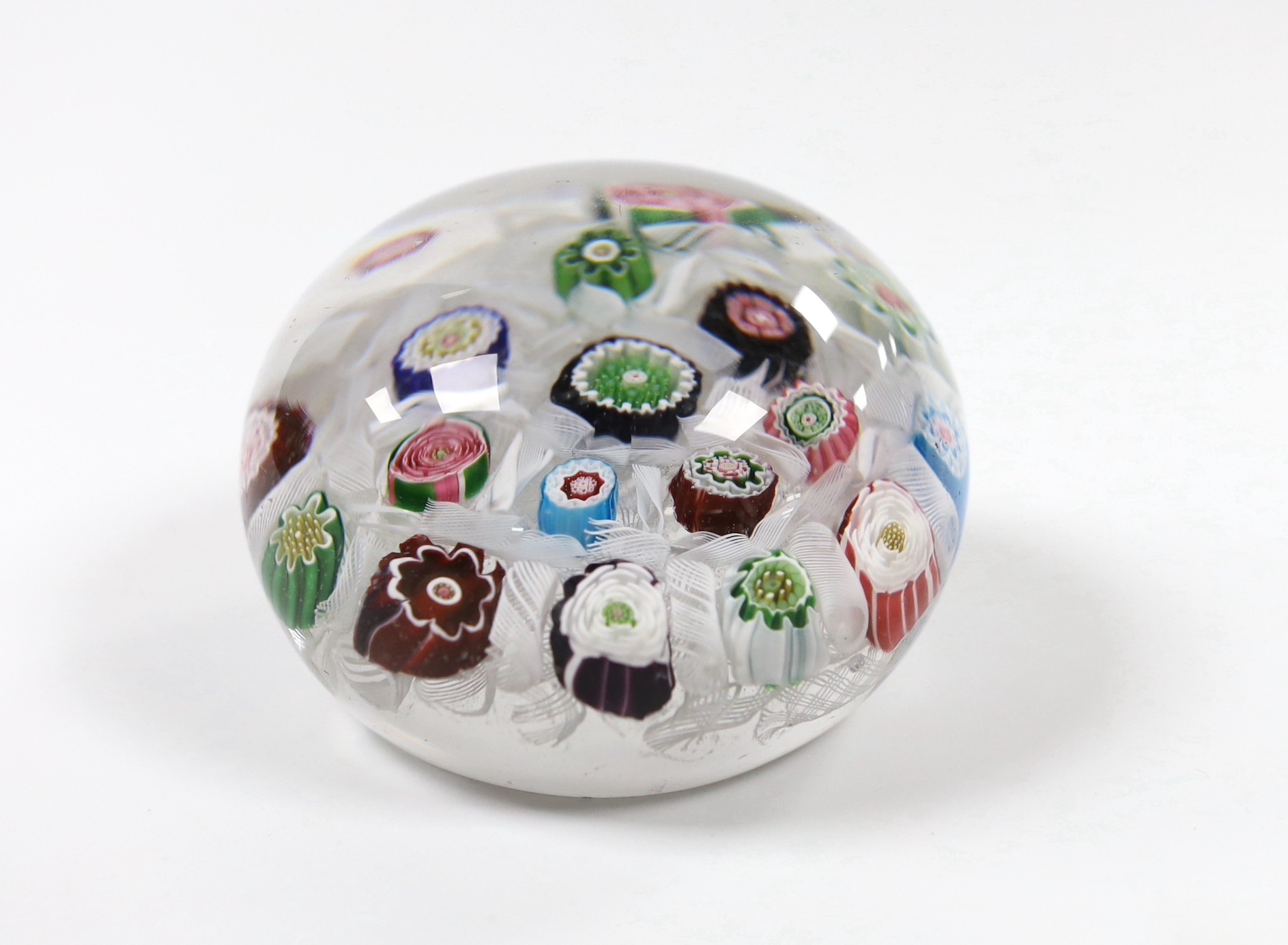A Clichy glass paperweight with Clichy rose